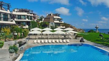Seasonal outdoor pool, pool umbrellas, pool loungers