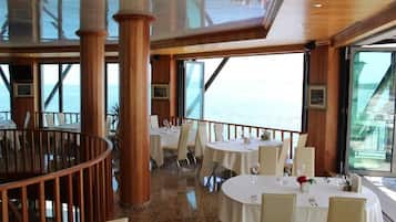 Breakfast, lunch, dinner served; beach views
