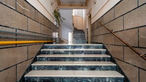 A marble staircase with a handrail, leading to an upper floor. - Classy Apartment in Koukaki, Walk to Metro & Acropolis (Athens)