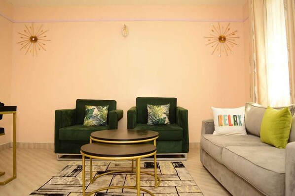 Business Apartment | Living area | 24-inch Smart TV with satellite channels - Lux Suites Naka Apartments Nakuru (Nakuru)