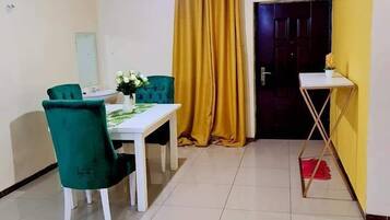 Deluxe Apartment | Living area | 24-inch Smart TV with digital channels