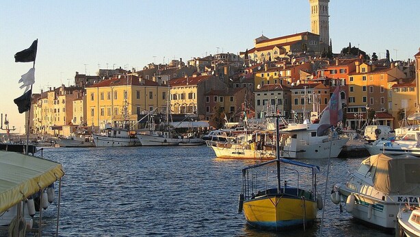 A harbor with boats, a prominent church, and colorful buildings. - Lovely apartment DESIREE in Rovinj (Rovinj)