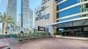 A modern building with the sign "IRISblue Bldg."