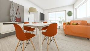 Un salon moderne avec un coin repas, comprenant une table à manger blanche, des chaises orange, un canapé et un téléviseur.