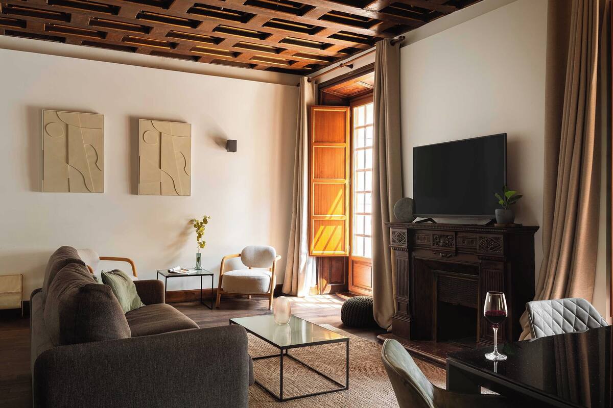 One-Bedroom Apartment with terrace | Living area | 50-inch TV with satellite channels
