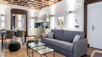 One-Bedroom Apartment with terrace | Living area | 50-inch TV with satellite channels