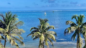 On the beach, sun loungers, beach towels