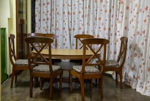 Enjoy meals in this cozy dining area with a round table and comfortable chairs.