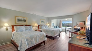 A hotel room with two beds, a dining table, and a TV. - On the Sea Palms Golf Course. 18th Hole, Fairway and Lagoon frontage (Saint Simons Island)