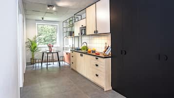 Classic Apartment | Private kitchen | Mini-fridge, microwave, stovetop, cookware/dishes/utensils