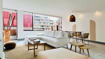 Design Apartment | Living area | 40-inch TV with cable channels