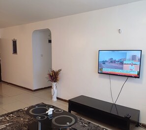Design Apartment | Living area | 24-inch Smart TV with digital channels