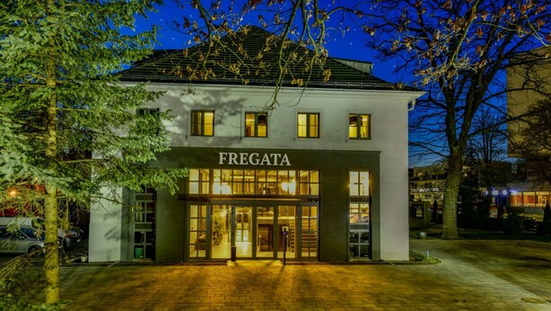A two-story building with a sign reading "FREGATA" at the entrance. - Fregata Kołobrzeg (Kolobrzeg)