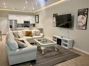 Living area - New cozy Katy home! 3 Bed-2.5 bath, Hot tub, Karaoke Mic, relaxing fireplace. (Katy)