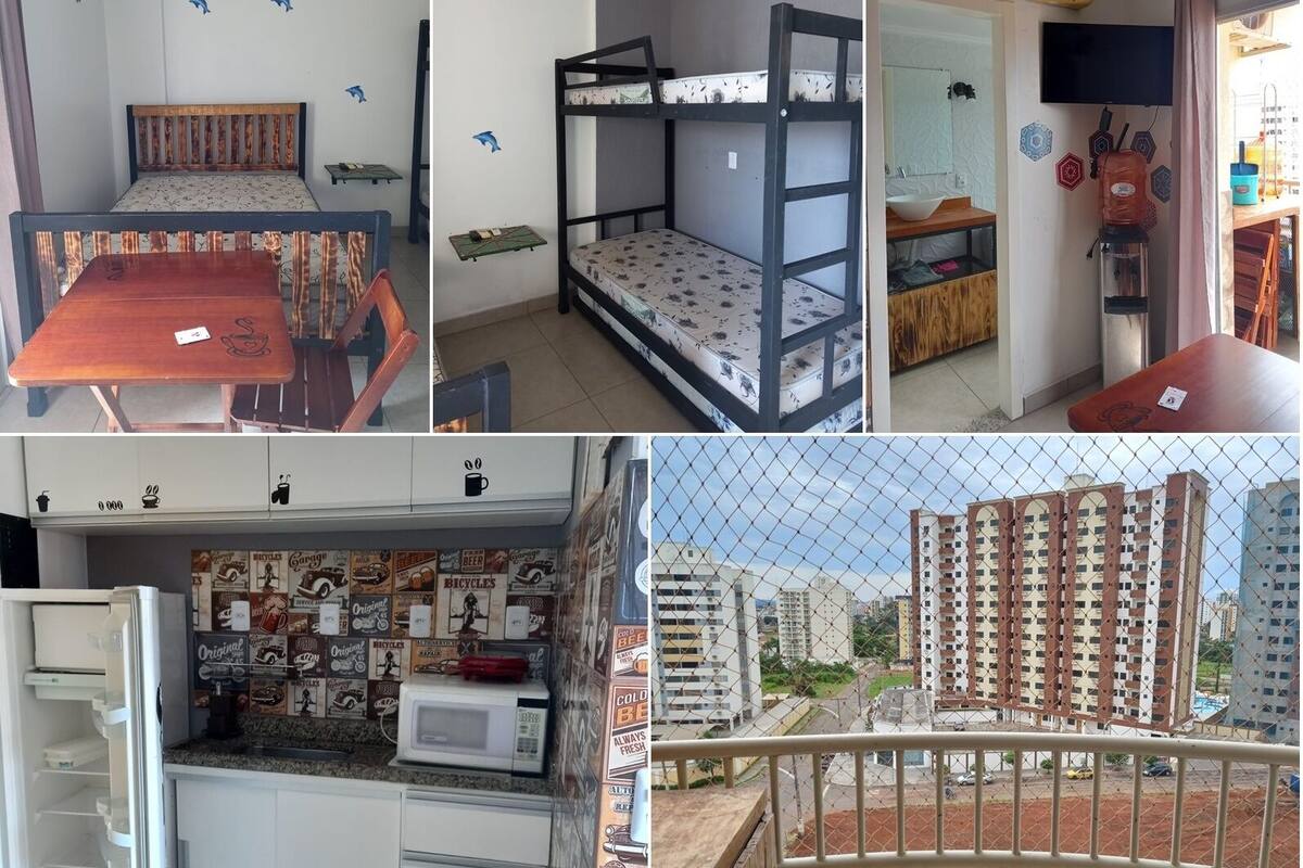 Ein Schlafzimmer mit einem Etagenbett, einem Esstisch und einer Küche inklusive Kühlschrank und Mikrowelle.