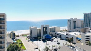 A hotel complex with multiple buildings, a parking lot, and a view of the beach and ocean. - OD tower II #14, ocean view Fantastic condo + pool (Myrtle Beach)