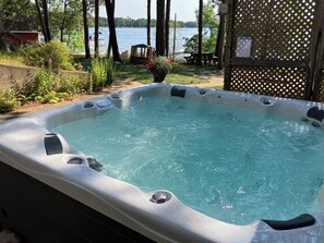 Outdoor spa tub - Two family, cozy, lake house retreat on Pine Lake. (Clintonville)