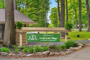 A sign welcoming visitors to Locust Lake Village, a private community.