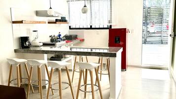 Fridge, microwave, stovetop, coffee/tea maker