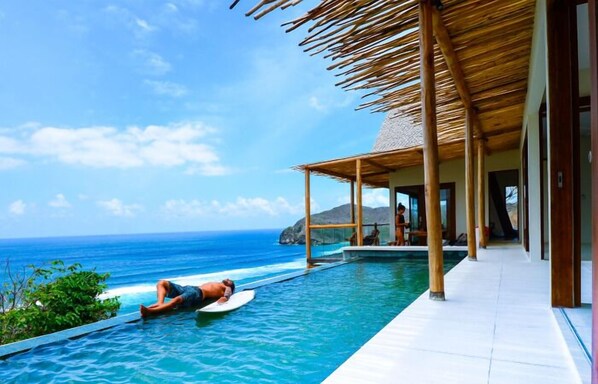 Deluxe Villa, Ocean View | Desk, laptop workspace, blackout drapes, free WiFi - Kini Resort & Village (Sumbawa Barat)