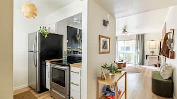 Fridge, dishwasher, coffee/tea maker, cookware/dishes/utensils