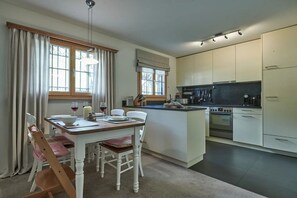 Fridge, stovetop, dishwasher, coffee/tea maker