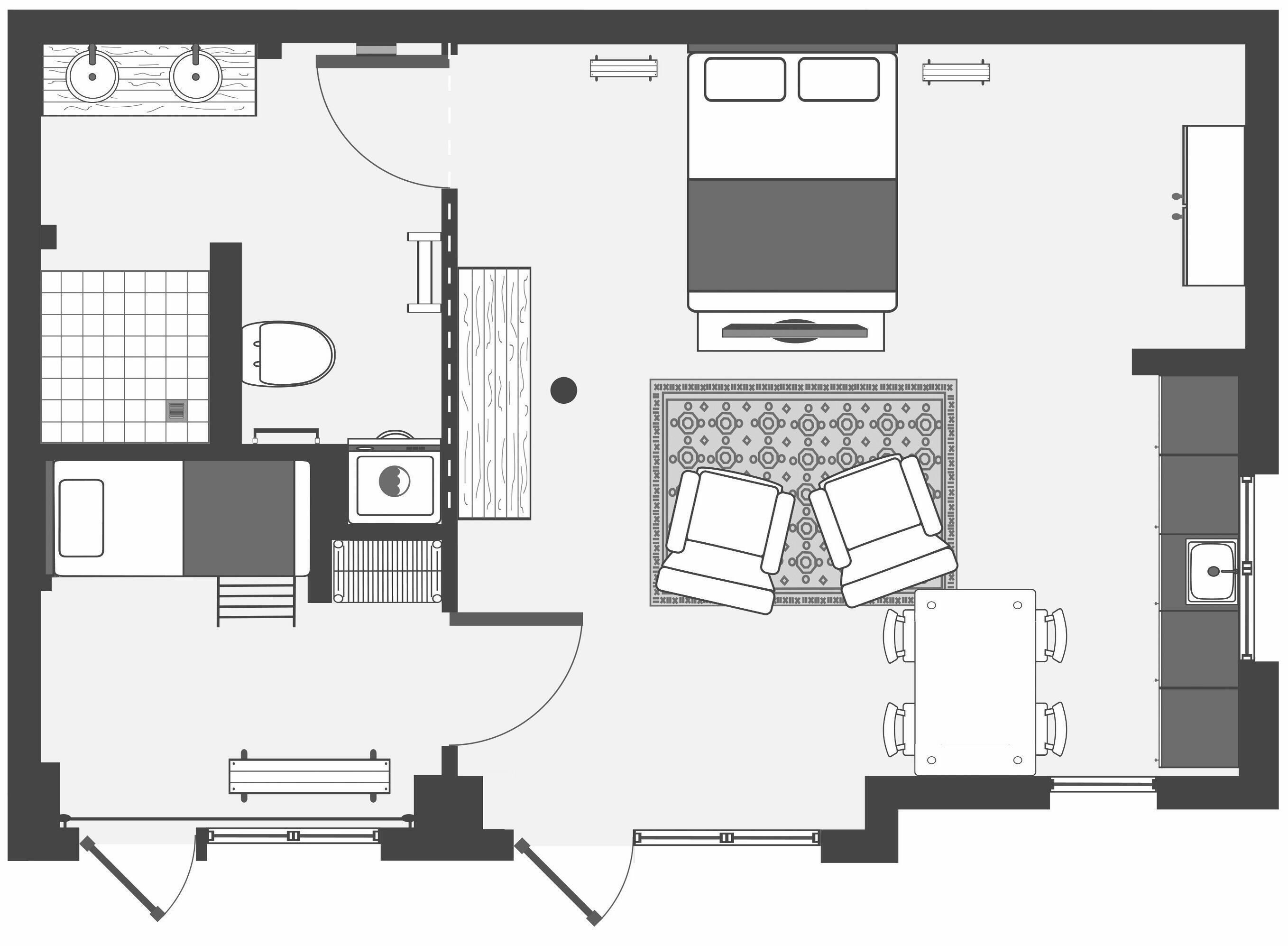 A floor plan of a hotel room with a bed, a desk, a chair, a wardrobe, a bathroom, and a small sitting area.