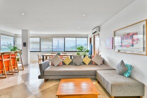 Apartment | Living area | 52-inch Smart TV with satellite channels, Netflix, streaming services - Bisma Apartments by Hombali (Canggu)