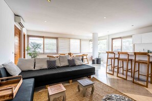 Apartment | Living area | 52-inch Smart TV with satellite channels, Netflix, streaming services - Bisma Apartments by Hombali (Canggu)