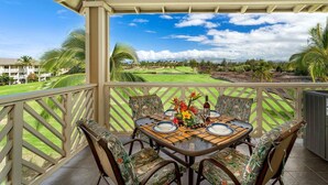 A covered outdoor dining area with a view of a golf course. - 🏖️Top-Floor Waikoloa Condo Overlooking Golf Course | Walk to A-Bay & Shops | Fairway Villas A31 (Waikoloa)