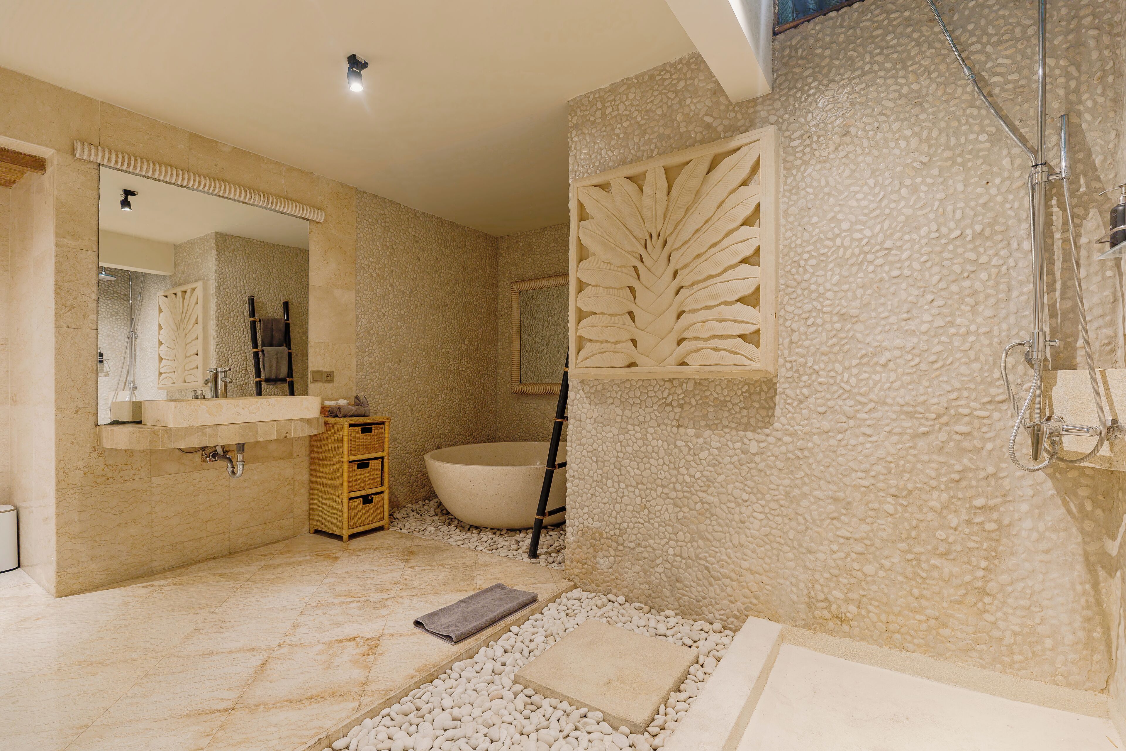A bathroom with a bathtub, a shower, and a sink.