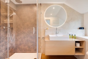 Shower, hair dryer, towels, soap