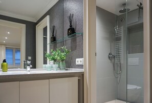 Shower, hair dryer, towels, soap