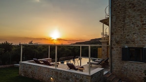 A stone building with a rooftop pool and lounge chairs. - Villa Nora in Ditiki Mani (West Mani)