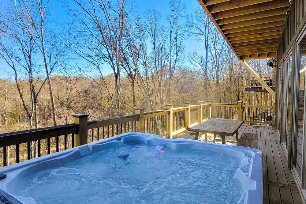 Scenic lake view cabin with game room, hot tub, grill, fireplaces, W\/D, & AC