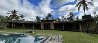 outdoor swimming pool with a picturesque garden for you to explore