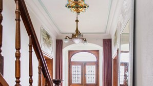 A wooden staircase leading to a door with a stained glass light fixture above. - Beautiful Mansion With Swimmingpool Close to Maastricht (Bilzen)