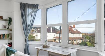 Bright Apartment w/ Parking & Distant Sea Views