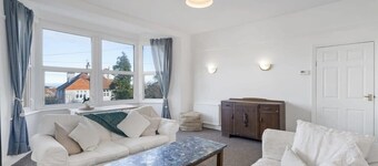 Bright Apartment w/ Parking & Distant Sea Views