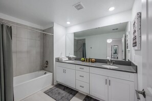 Shower, hair dryer, towels - Luxury Chic, Modern Home, Prime Location (Kissimmee)