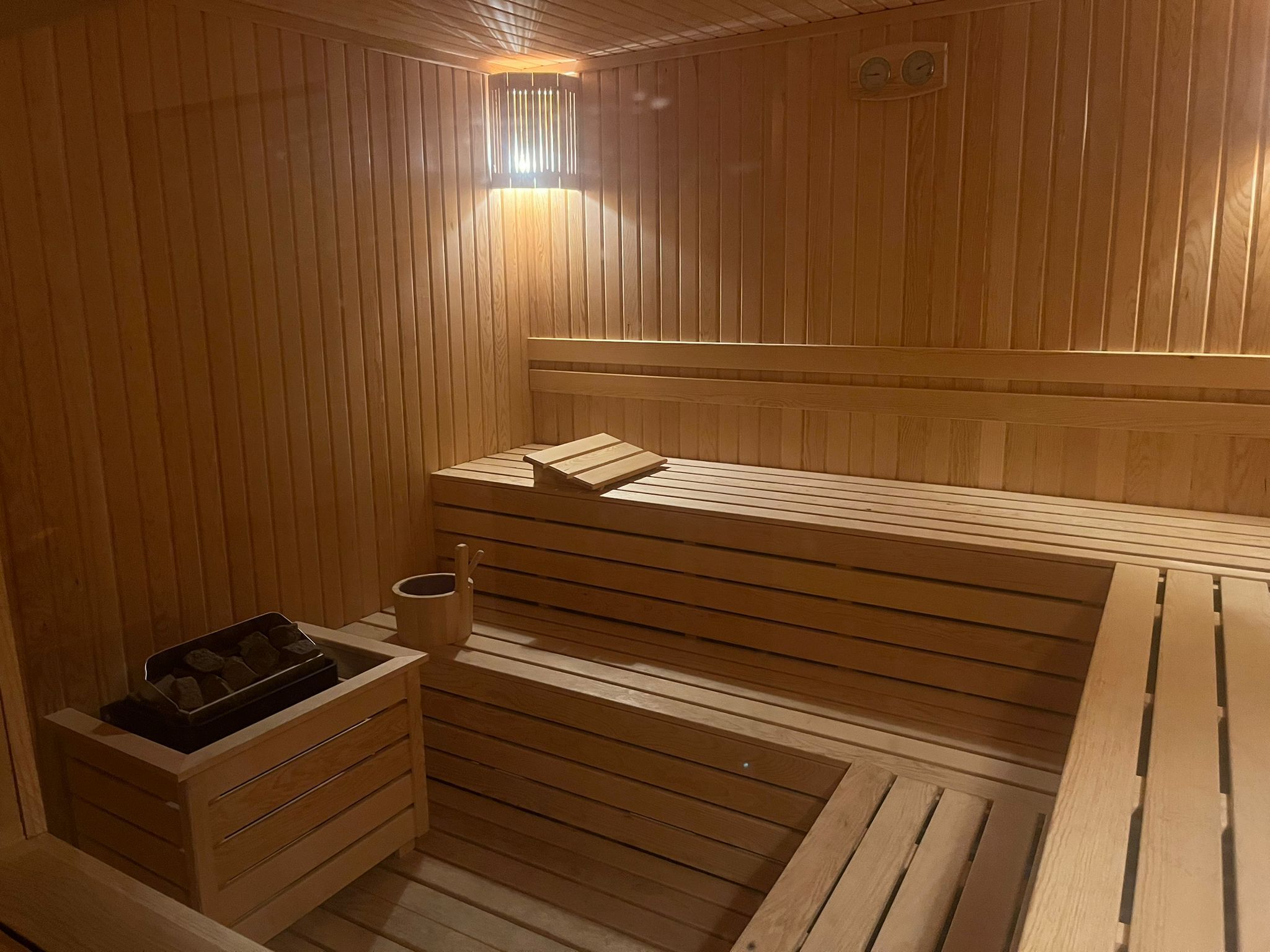 A wooden sauna with benches and a bench seat, a wooden bench, a wooden bench seat, a wooden bench, a wooden bench seat, a wooden bench, a wooden bench seat, a wooden bench, a wooden bench seat, a wooden bench, a wooden bench seat, a wooden bench, a wooden bench seat, a wooden bench, a wooden bench seat, a wooden bench, a wooden bench seat, a wooden bench, a wooden bench seat, a wooden bench, a wooden bench seat, a wooden bench, a wooden bench seat, a wooden bench, a wooden bench seat, a wooden bench, a wooden bench seat, a wooden bench, a wooden bench seat, a wooden bench, a wooden bench seat, a wooden bench, a wooden bench seat, a wooden bench, a wooden bench seat, a wooden bench, a wooden bench seat, a wooden bench, a wooden bench seat, a wooden bench, a wooden bench seat, a wooden bench, a wooden bench