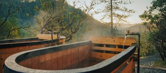 Off-grid tiny home on 6 secluded acres w/ outdoor soaking tubs and sauna!