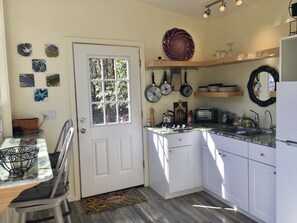 Fridge, stovetop, coffee/tea maker, electric kettle