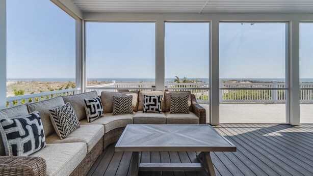 A covered outdoor seating area with a view of the beach. - 510 S. Bayshore Dr.- 4 Bedroom Waterfront home located in Broadkill Beach, with Spectacular Views! (Milton)