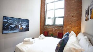 1 bedroom, desk, iron/ironing board, travel crib