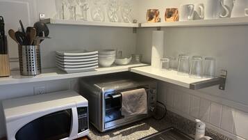 Fridge, microwave, stovetop, coffee/tea maker