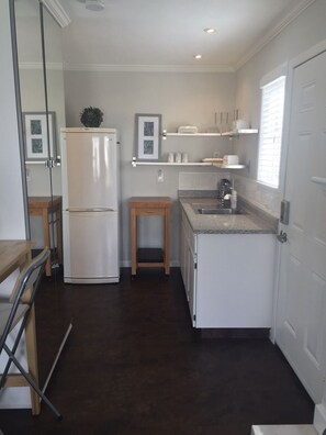 Fridge, microwave, stovetop, coffee/tea maker