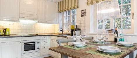 Fridge, stovetop, dishwasher, coffee/tea maker