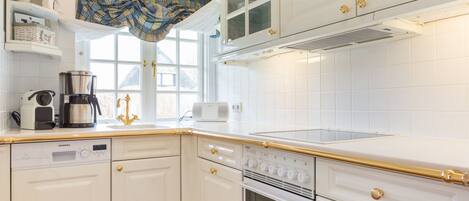 Fridge, stovetop, dishwasher, coffee/tea maker