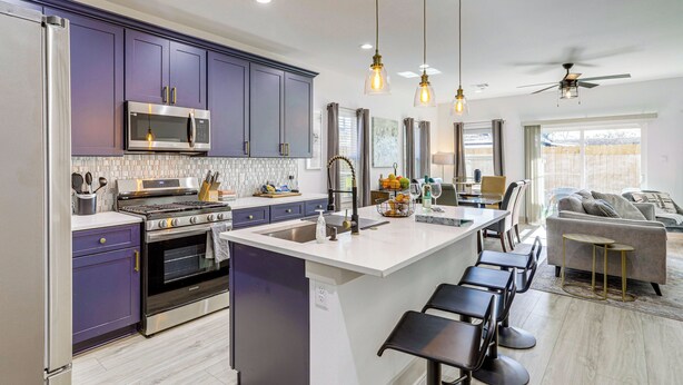 A modern kitchen with a central island, stainless steel appliances, and pendant lighting. - Modern Houston Retreat w/ Patio, 11 Mi to Dtwn (Houston)